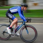 timelapse photography of man riding bicycle